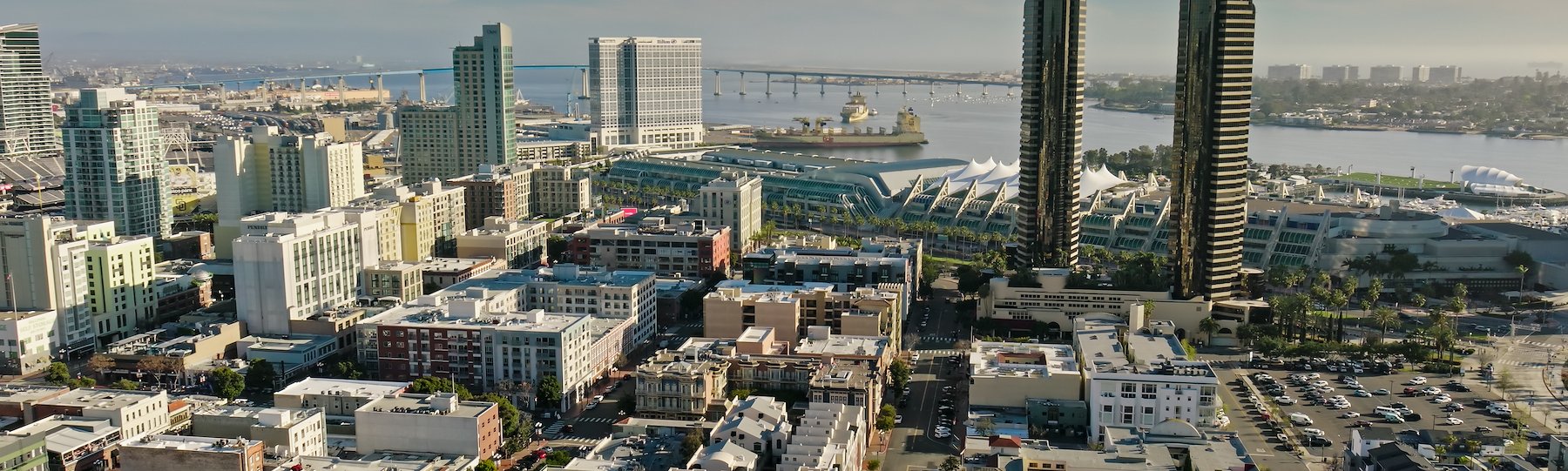 Aerial view of downtown San Diego, San Diego Bay, and the waterfront near the Gaslamp Quarter.